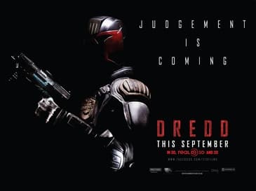 Theatrical poster for Dredd (2012) showing Karl Urban as Judge Dredd in a helmet, rifle across his chest, in front of a glowing city tower.